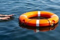 The man`s hands reach for the lifebuoy in the water. The concept of saving drowning Royalty Free Stock Photo