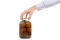 Man`s hands tomatoes in a jar Royalty Free Stock Photo