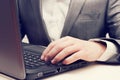 Man's Hands Typing On Laptop Keyboard