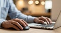 Man s hands typing on laptop keyboard and using computer mouse Royalty Free Stock Photo