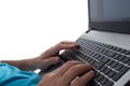 Man`s hands typing on laptop notebook keyboard isolated on white background. Man browsing information on internet