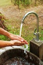 Man's hands under the running water from the faucet Royalty Free Stock Photo