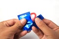 Man's Hands Unwrapping a Condom