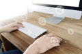 Man`s hands using computer with social connect icons Royalty Free Stock Photo