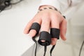 Man`s hands on which polygraph sensors are worn