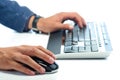 Man's hands working with computer mouse and computer keyboard Royalty Free Stock Photo