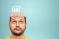 In the man`s head is an image of the brain and a loading scale. Concept for education, reading, exam preparation, study, bookworm Royalty Free Stock Photo