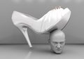 Man's head under a female heel