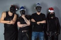 Man's metal band in christmas hats