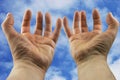 Hands stretched towards the sky Royalty Free Stock Photo