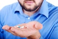 Mans palm with medicine pills on Royalty Free Stock Photo