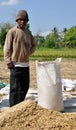 Man with sack of rice Royalty Free Stock Photo