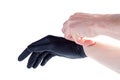 Man safely removing, taking off black protective disposable medical rubber gloves hand gesture, isolated on white, cut out