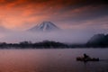 Man sail boat at lake Shoji with mt Fuji and twilight sky, Yamanashi Royalty Free Stock Photo