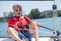 man sailing boat on lake Royalty Free Stock Photo