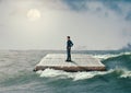 Man sailing on the Holy Bible, in rough seas, seeking salvation by faith in Jesus Christ, Son of God