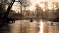 A man sailing the river during a peaceful evening sunset Royalty Free Stock Photo