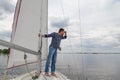 Man is sailing  yacht and looking through binoculars Royalty Free Stock Photo