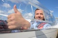 Man in sailplane making thumbs up gesture Royalty Free Stock Photo