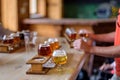 Beer flights lined up on a table at a microbrewery