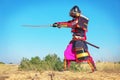 Man in samurai costume with sword. Royalty Free Stock Photo