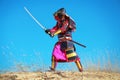 Man in samurai costume with sword. Royalty Free Stock Photo