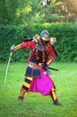 Man in samurai costume with sword. Royalty Free Stock Photo