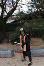 Man in Samurai Dress, Tourist Can be take a photo to keep a memorial at Himeji Castle.