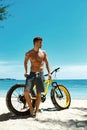 Man With Sand Bike On Beach Enjoying Summer Travel Vacation Royalty Free Stock Photo