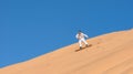 Man sandboarding in Namibia Royalty Free Stock Photo