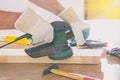 Man sanding a wood with orbital sander Royalty Free Stock Photo