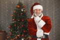 Man in santa claus costume looking at the camera