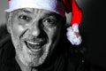 man with Santa Claus hat frontal view, black and white photo, Christmas is coming.