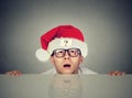 Man in santa claus hat with question mark Royalty Free Stock Photo