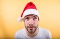 Man santa with cunning face on orange background