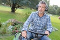 Man sat on mower Royalty Free Stock Photo