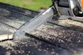 Man sawing boards with a chainsaw. Close up Royalty Free Stock Photo