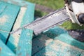 Man sawing boards with a chainsaw. Close up Royalty Free Stock Photo