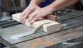 Man Sawing a Piece of Wood for a DIY Project Royalty Free Stock Photo