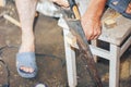 Man sawing plank of wood Royalty Free Stock Photo