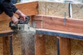 Man sawing wood with chain saw Royalty Free Stock Photo