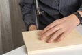 a man sawing a wooden detail with a jigsaw. wood cutting at home Royalty Free Stock Photo