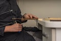 a man sawing a wooden detail with a jigsaw. wood cutting at home Royalty Free Stock Photo