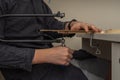 a man sawing a wooden detail with a jigsaw. wood cutting at home Royalty Free Stock Photo