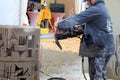 Man Saws Concrete with ICS Chain Saw