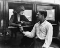 Man saying goodbye to woman in car Royalty Free Stock Photo