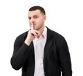 Man saying hush and be quiet with finger on lips gesture looking at camera, isolated on white background Royalty Free Stock Photo