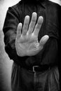 A man saying stop or no with the open hand gesture