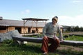 Man in Scandinavian folk clothes relaxing on bench Royalty Free Stock Photo