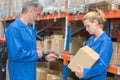 Man scanning box with hand held scanner